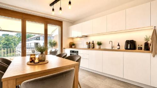 CASATAX - Magnifique attique de 3 pièces avec terrasse périphérique — photo 2